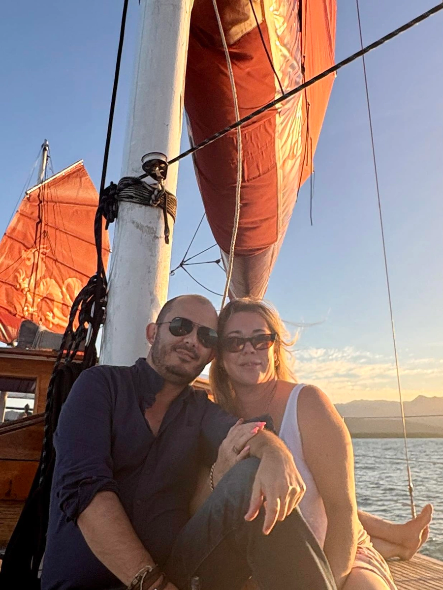 Gabriel and Kristy together on deck at sunset